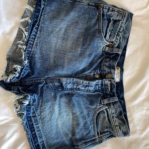 Free People: Dark blue distressed denim shorts